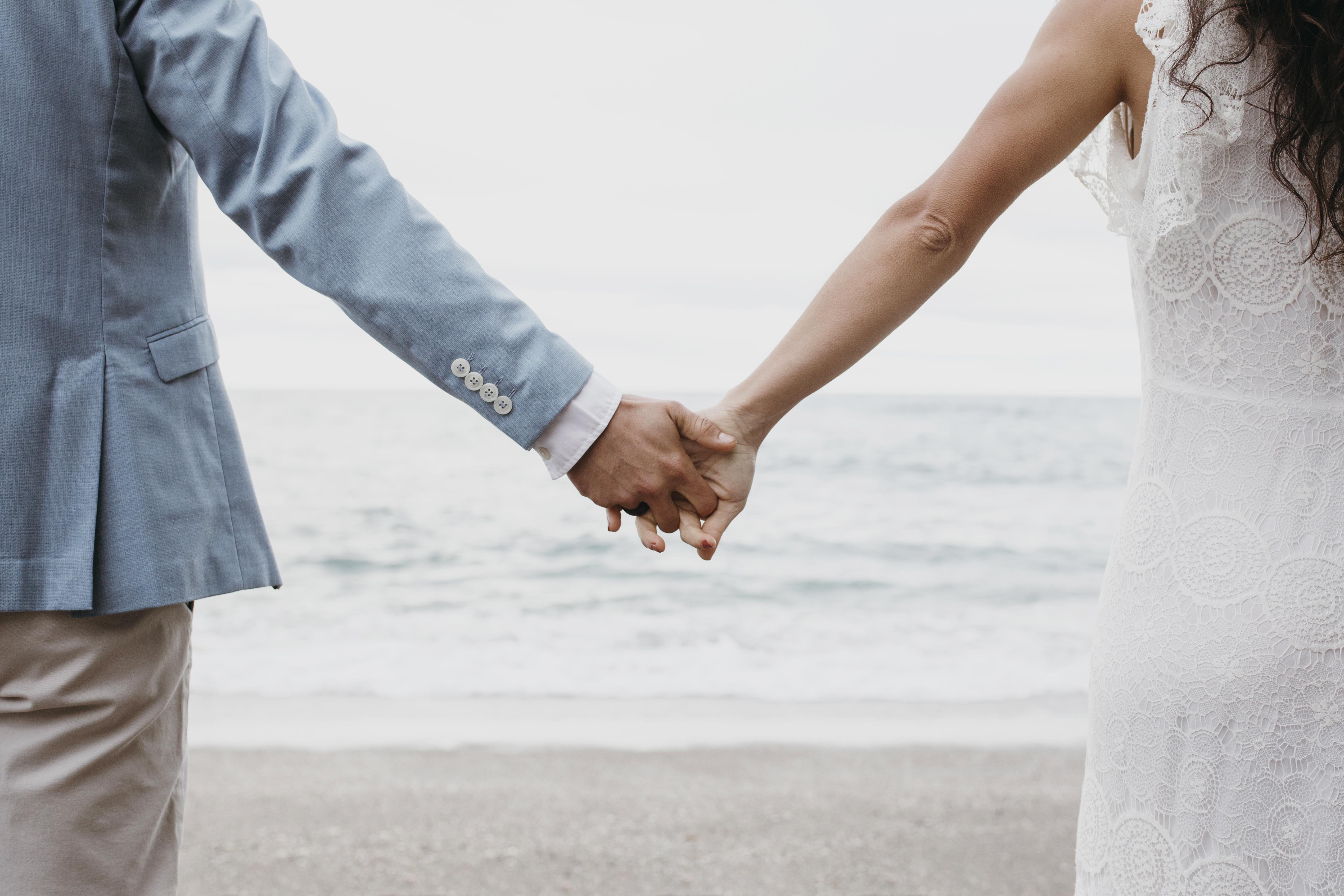 beautiful-husband-wife-posing-beach-their-wedding.jpg