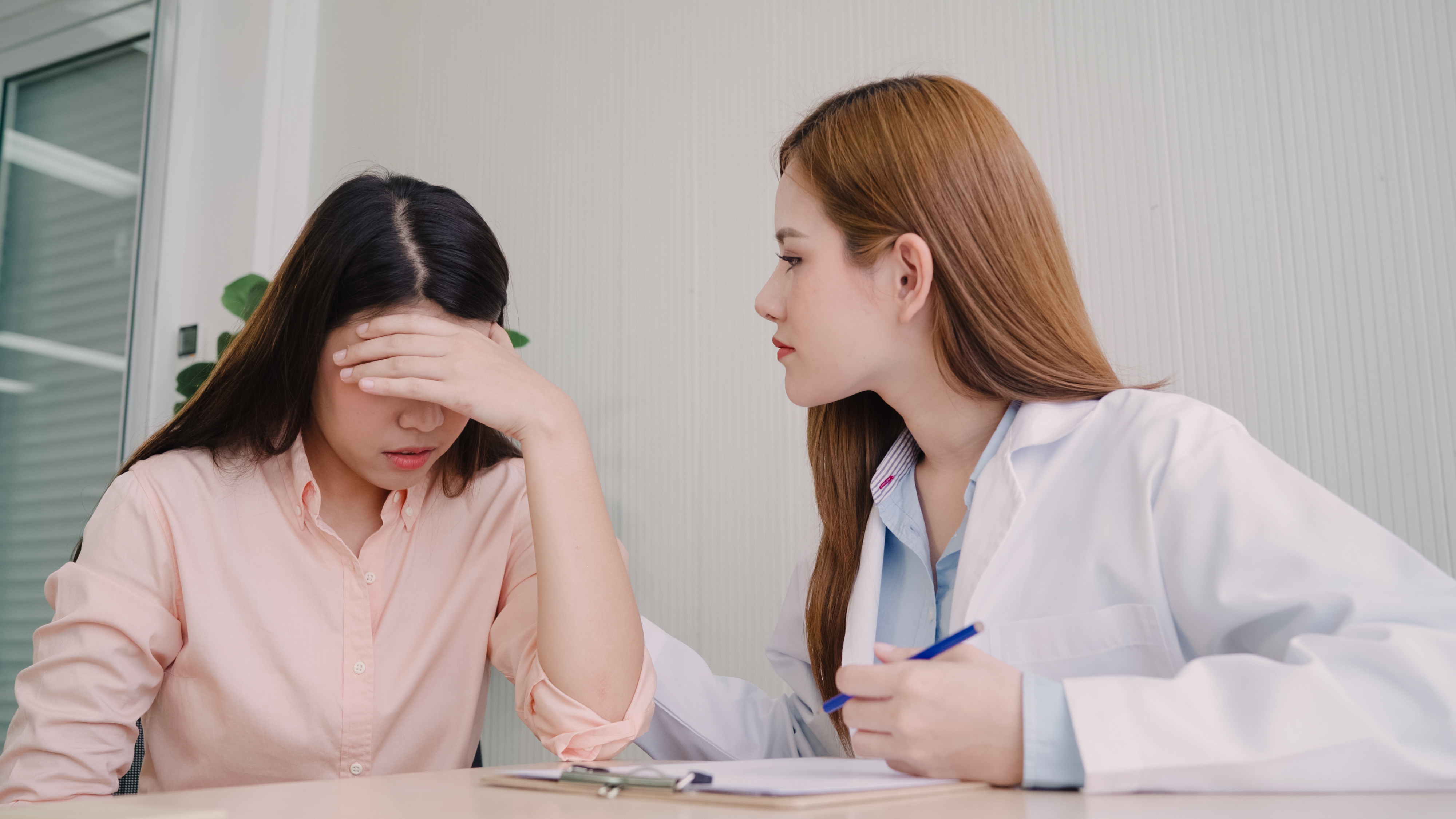 doctor-talking-unhappy-teenage-patient-exam-room.jpg